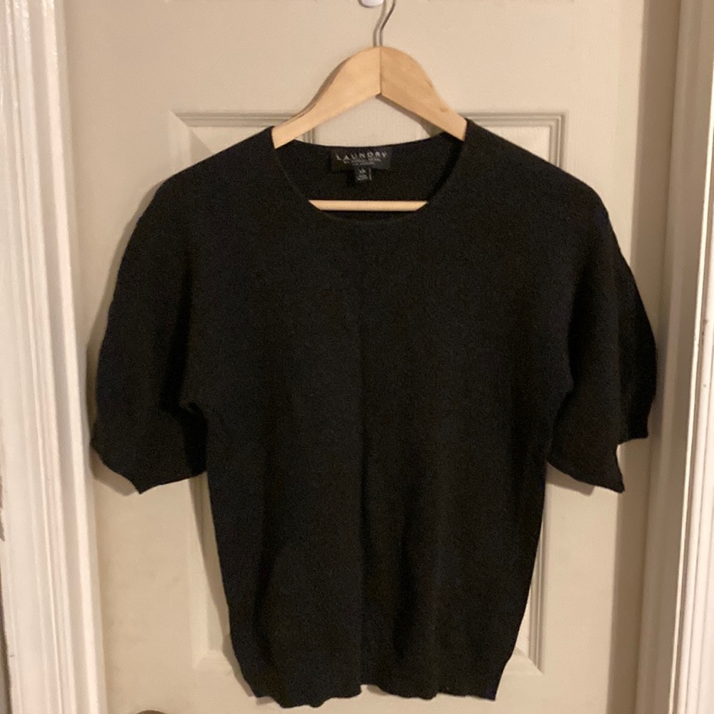 Black short sleeve sweater with puffy sleeve.